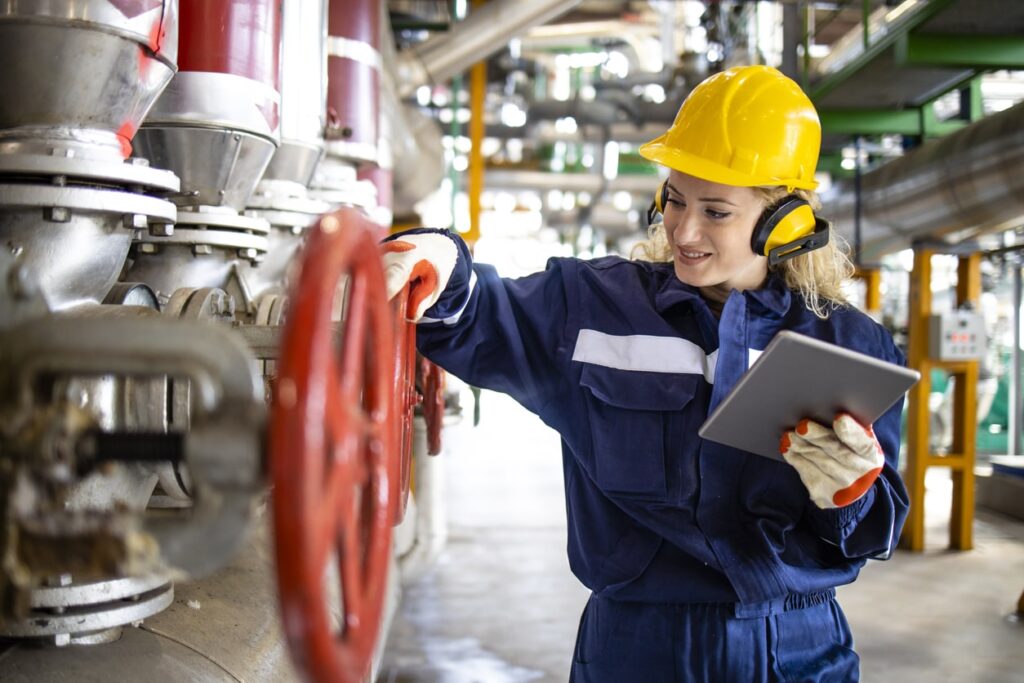 worker working inside chemical plant worker working inside chemical plant